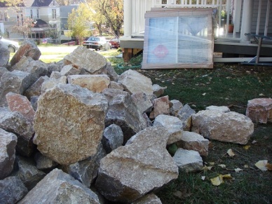 Limestone rocks will help build the rest of our window retaining walls.